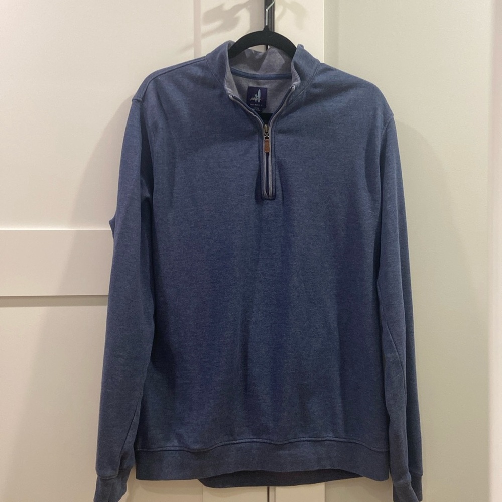 It’s a Johnnie O 1/4 zip in dusty navy blue. Worn a couple times. Size is large.